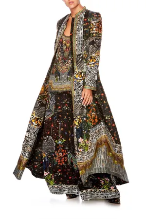 LONG PANELLED COAT BEHIND CLOSED DOORS